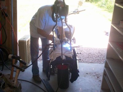 Welding the sissy bar onto the side plates