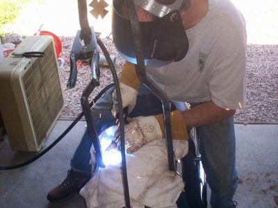Welding the sissy bar onto the side plates